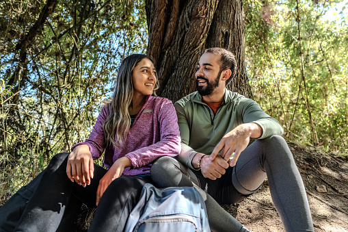 Couple talking on the forest