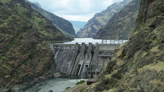 Aerial reveal Hells Canyon Dam on Snake River in Idaho