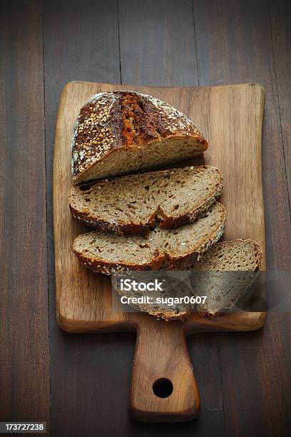 Spelt Flour Bread Sliced On A Cutting Board For Breakfast Stock Photo - Download Image Now