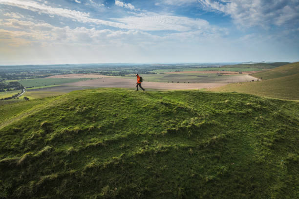 Hiker on countryside in Pewsey, Uk, daytime