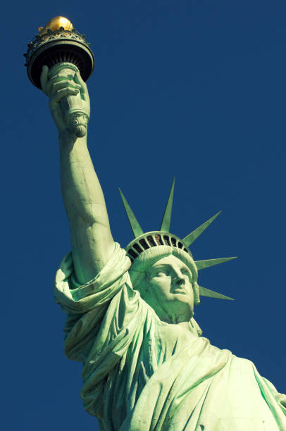 istock Statue of Liberty Close-Up Torch Blue Sky Copy Space 173728167