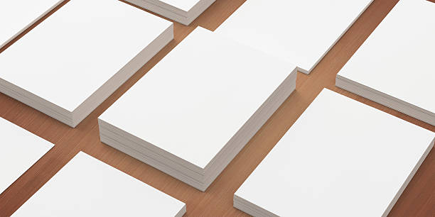 istock Blank A4 paper stacks on wooden background 173728634