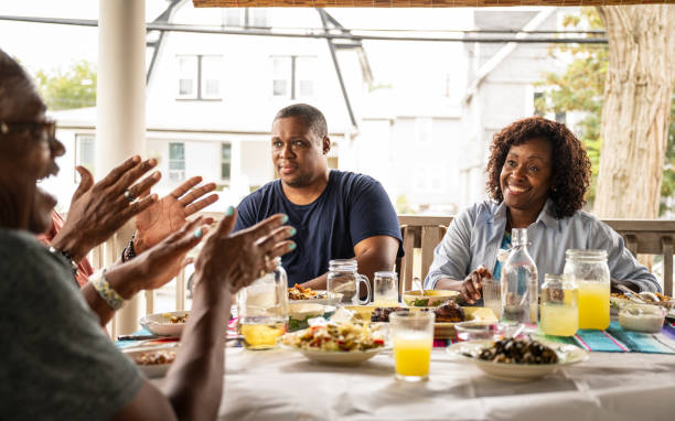 istock Family members enjoying midday meal and conversation 1737291240