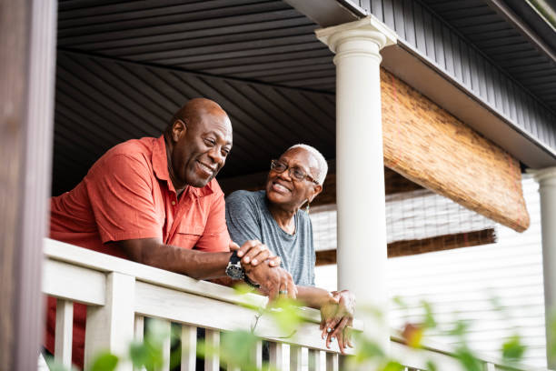 istock Happy retired couple enjoying leisure time on veranda 1737291299