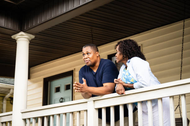 Worried Black couple discussing challenging times