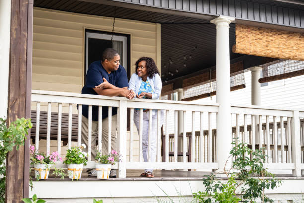 istock Black couple enjoying weekend chat on veranda, summertime 1737291822