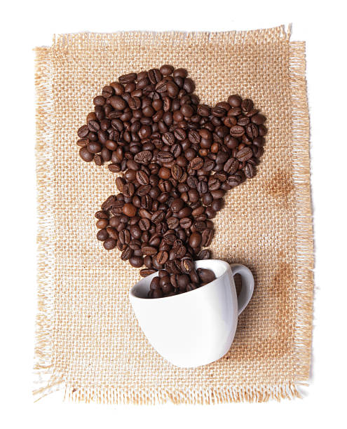 istock cup with heap of coffee grains on burlap background 173731223