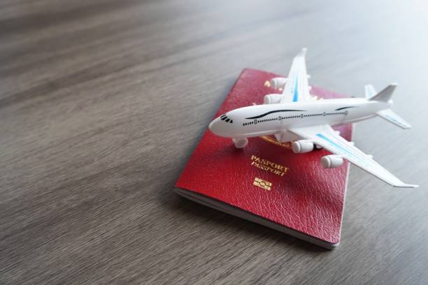istock Closeup image of toy plane and passport. 1737316469