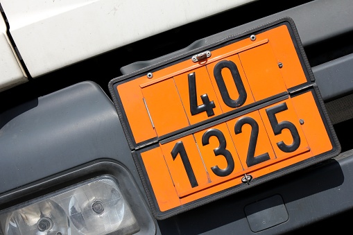 orange-colored plate with hazard-identification number 40 and UN-Number 1325 (flammable solids, organic, n.o.s.)