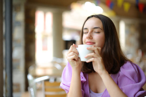 istock Relaxed woman smelling coffe in a terrace 1737326600