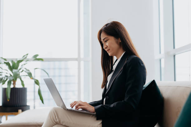 istock Asian businesswoman using laptop in modern office 1737333648
