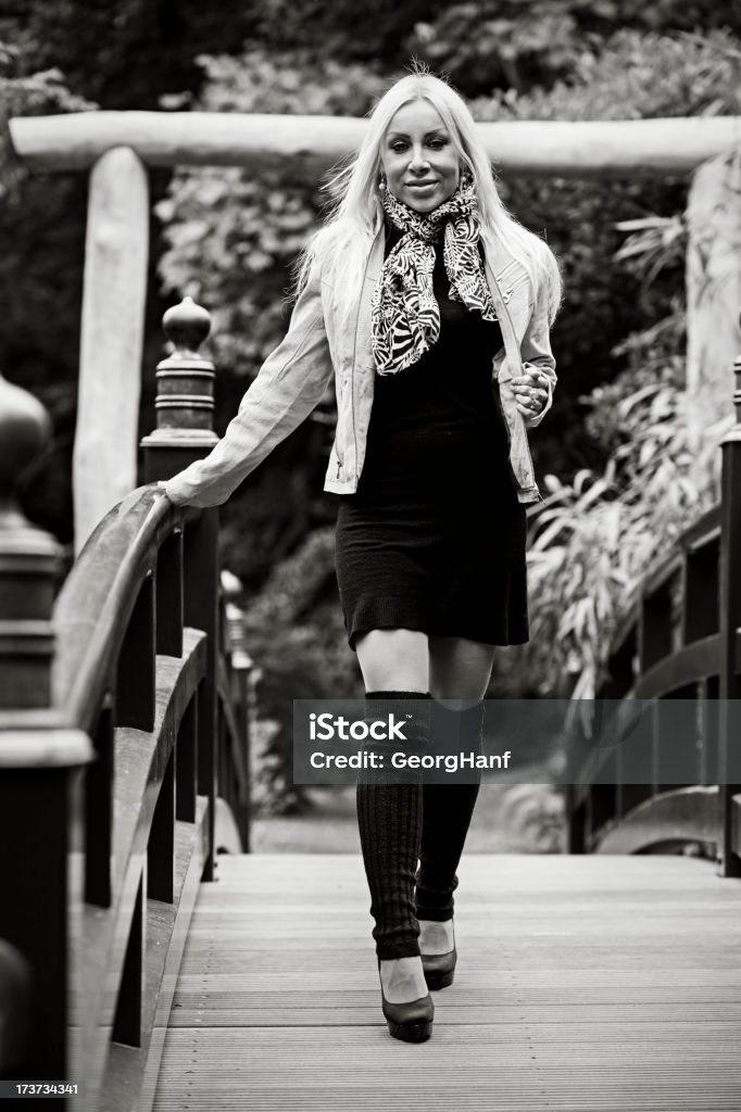 Young blonde woman Young blond woman in the garden. 25-29 Years Stock Photo