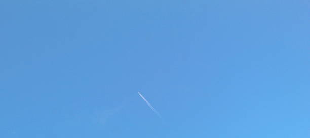 istock Small airplane soaring across blue sky 1737349676