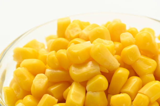 Sweet corn in a glass bowl on a white background