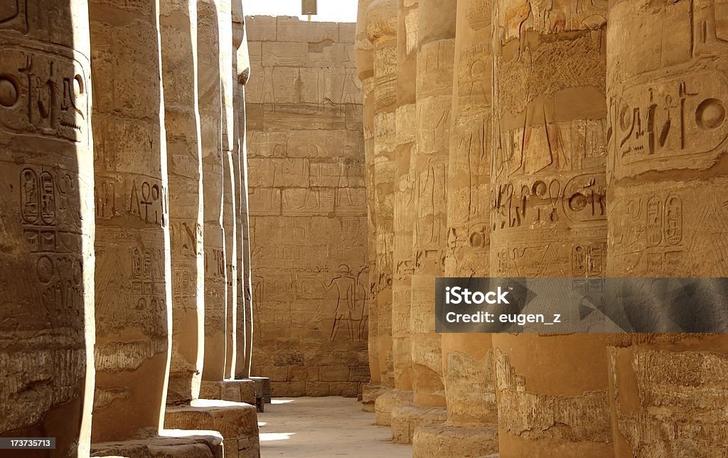 Great Hypostyle Hall of the Karnak Temple, Luxor, Egypt. The Karnak Temple Complex, commonly known as Karnak, comprises a vast mix of decayed temples, chapels, pylons, and other buildings. Building at the complex began during the reign of Sesostris I in the Middle Kingdom and continued into the Ptolemaic period, although most of the extant buildings date from the New Kingdom. Rameses II Stock Photo