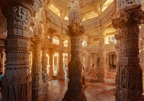 Bas-relief at columns at famous ancient Ranakpur Jain temple in Rajasthan state, India