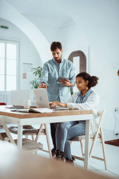 istock Diverse entrepreneurs working together in large open space start up office 1737388834