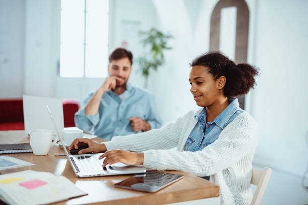 istock Diverse entrepreneurs working together in modern start up office 1737389389