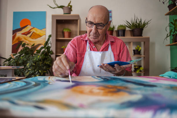 istock Senior Artist at Work with Watercolors 1737393223