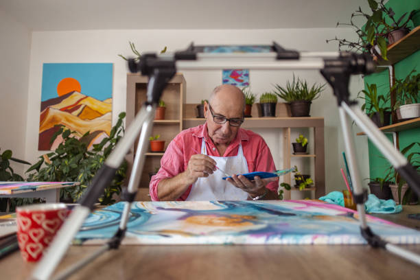 istock Senior Male Painter's Craft and Vlog 1737393788