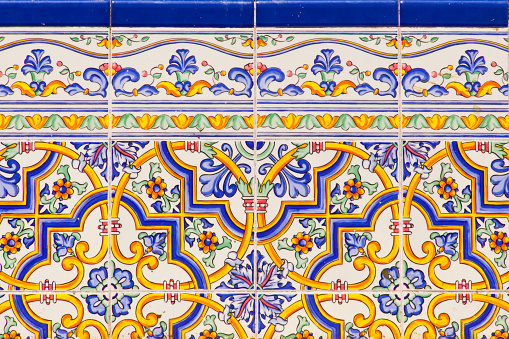 Multi colored traditional tiles  full frame view, suitable for backgrounds, blue border frame. Vilagarcía de Arousa, Rías Baixas, Pontevedra province, Galicia, Spain.