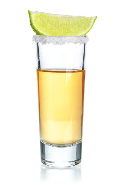 istock Gold tequila shot isolated on white background 1737402834