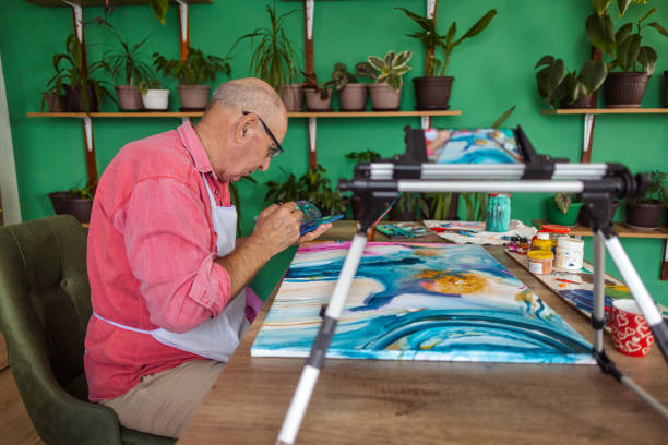 istock Senior Artist Painting and Vlogging 1737424100
