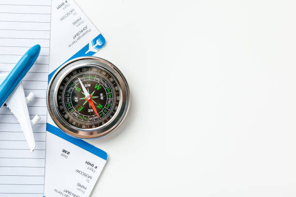 istock Time to Travel. Idea for tourism with flight tickets and compass on white 1737431329
