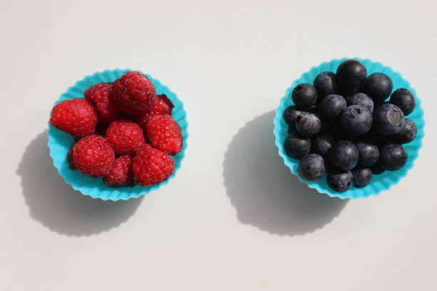 istock white plate with raspberries and blueberries on a white background 1737432395