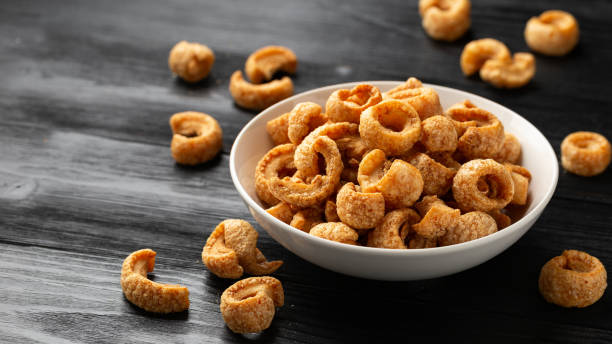 istock Crispy Pork crackling, scratchings. deep fries in white bowl 1737435289