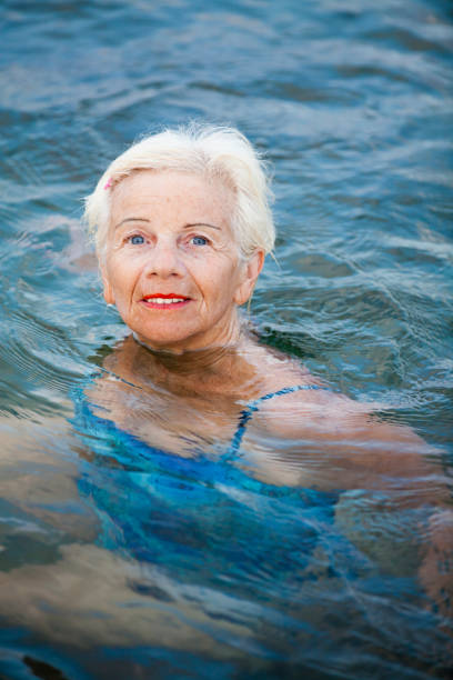 istock Elderly woman relaxing in water 173745221