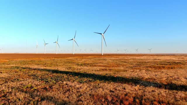 Flying away from Wind Turbines in the Texas Desert.