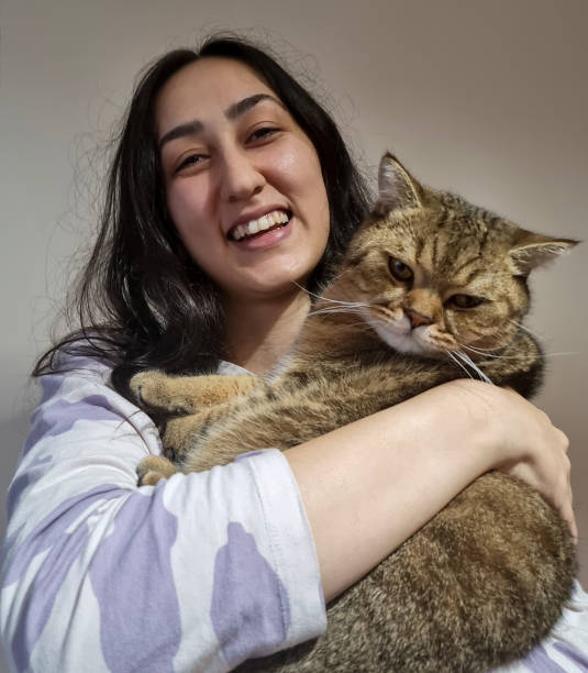 istock Selfies with her feline friend 1737460727
