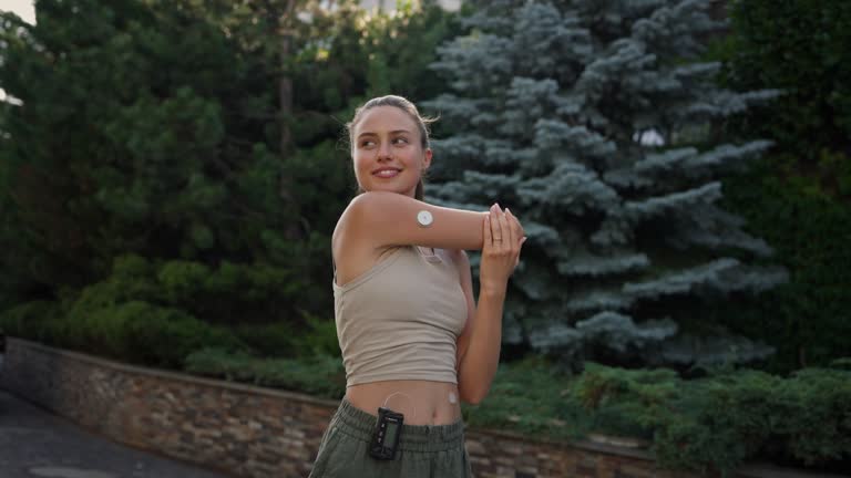 Beautiful diabetic woman preparing for outdoor run in the city.