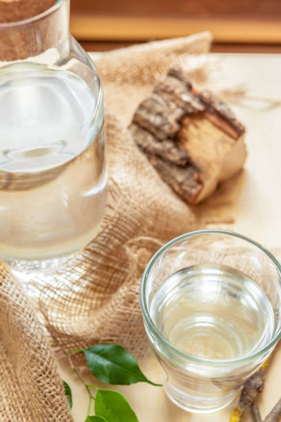 istock Bottle with clean water and the green leafs background close up 1737476540