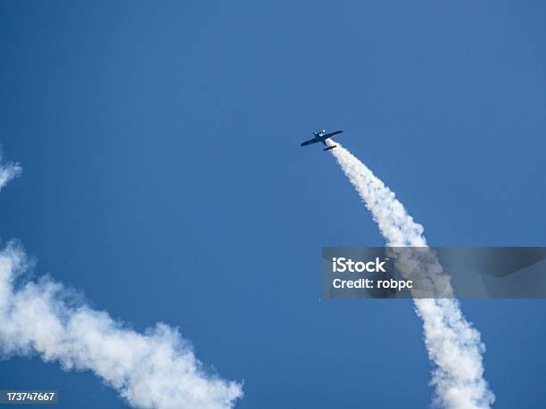 Biplane Exhaust Trail Stock Photo - Download Image Now - Biplane, Vapor Trail, Airplane