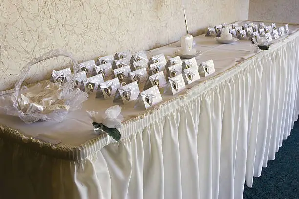 Several wedding placecards on a table right before a wedding reception.