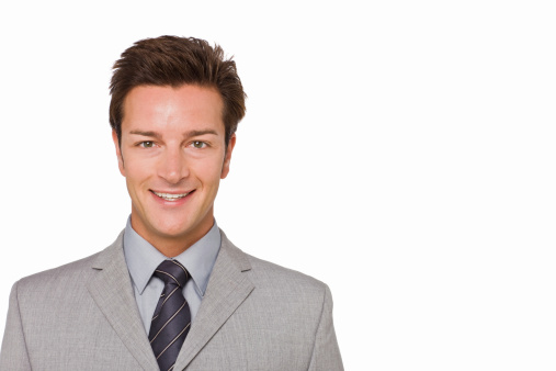 Closeup portrait of a happy young businessman isolated on white background