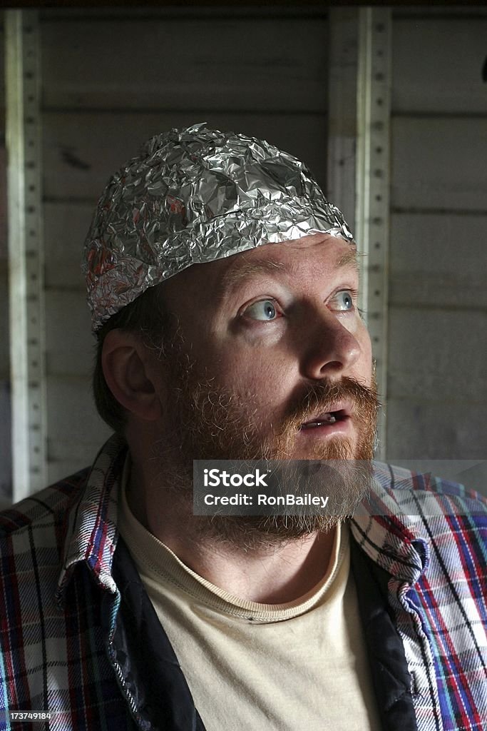 Crazy Guy In A Tin Foil Hat A crazy guy wearing a tin-foil hat.All images in this series... Hat Stock Photo