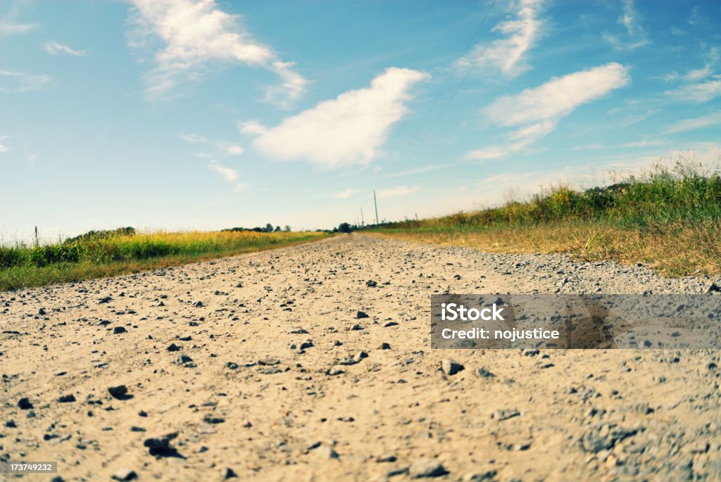 Inclinar Farm Road - Foto de stock de Agricultura royalty-free