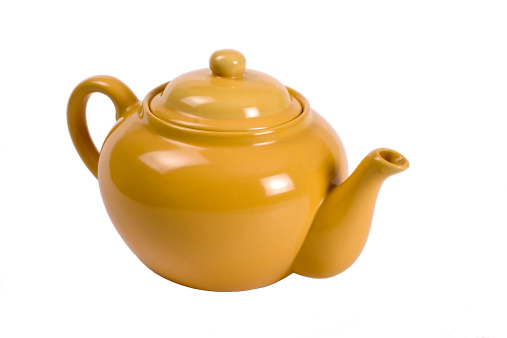 A mustard colored teapot.
