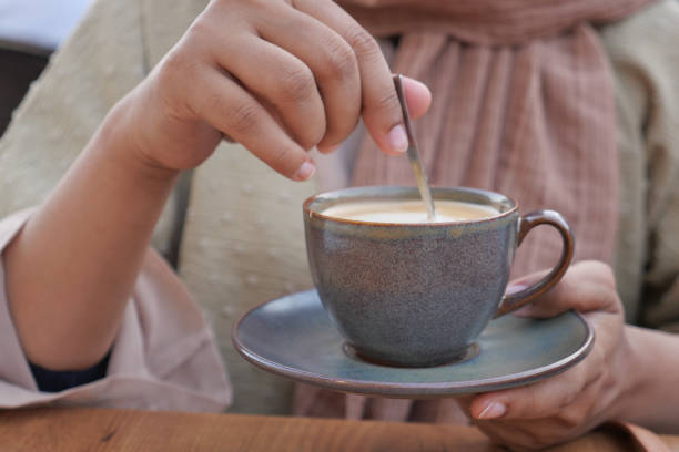 istock women holding a coffee cup 1737499478