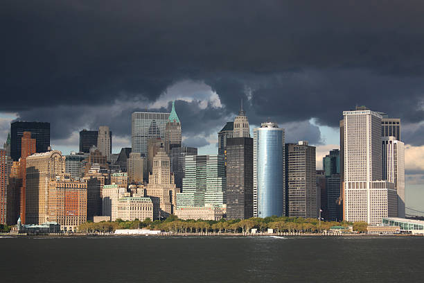istock View at downtown Manhattan from the water with thunderstorm 173750355