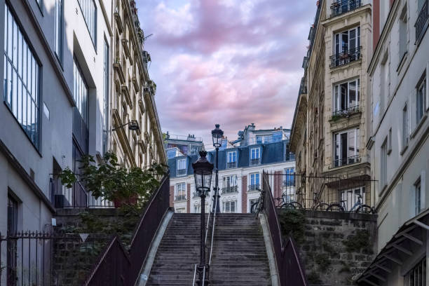Paris, romantic staircase in Montmartre, typical buildings and floor lamp