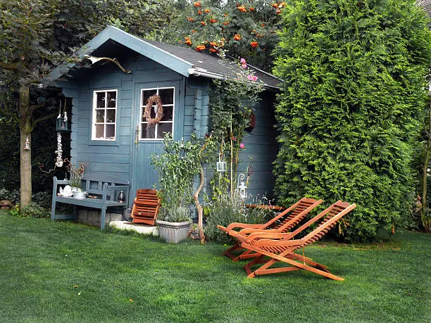 Garden house and garden chairs - a nice place for recreation after work is done.