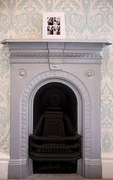 istock Old Fireplace with Photo on Mantelpiece. 173751363