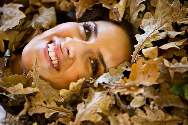 istock Woman with autumn leaves 173751732
