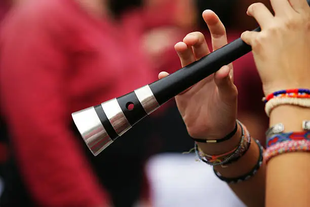 "Playing the gralla: a traditional instrument, which is usually played in popular ancestral festivities in Catalonia (Spain)"