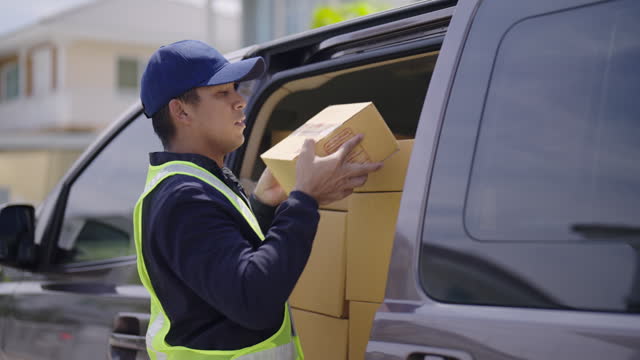 Delivery man prepare a package parcel at transport van and deliver the box to customer at home.