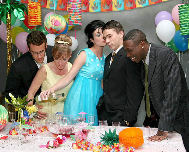 Trouble. A group of high school students looking for trouble as they spike the punch at prom. admired stock pictures, royalty-free photos & images